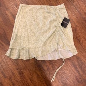 Green floral mini skirt